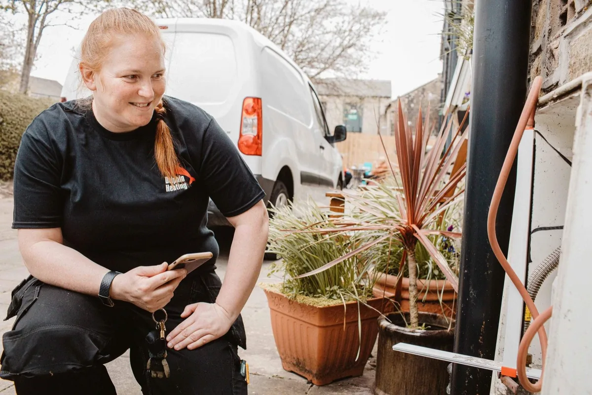 Fay of Dolphin Heating, a Gas Safe registered engineer in Huddersfield, working on a boiler